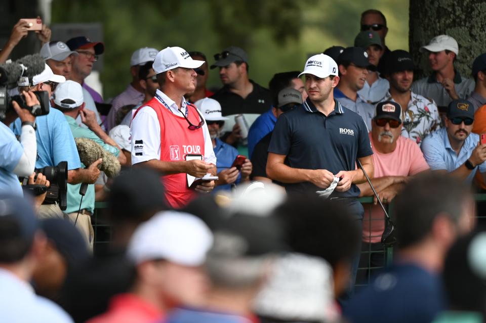 Sep 5, 2021; Atlanta, Georgia, USA; Patrick Cantlay talks to his caddie Matthew Minister on the 10th hole during the final round of the Tour Championship golf tournament. Mandatory Credit: Adam Hagy-USA TODAY Sports