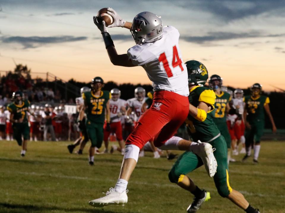 West Lafayette Red Devils Cooper Kitchel (14) catches a pass during the IHSAA football game against the Benton Central Bison, Saturday, Sept. 23, 2023, at Benton Central High School in Oxford, Ind.