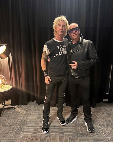 <p>Susan Holmes McKagan</p> Duff McKagan and Andrew Dice Clay in Duff's holding room at MetLife Stadium on August 15, 2023.