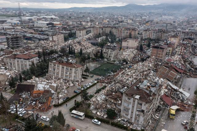 An aerial view of debris of a collapsed building after a 7.7 magnitude earthquake struck Hatay, Turkey