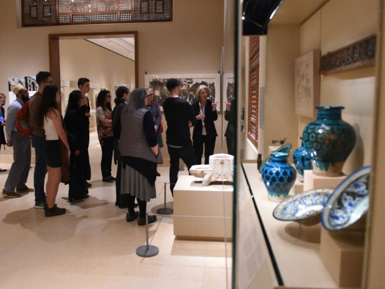 Curators at the Metropolitan Museum of Art talk to visitors about works created in the lands that are now Iraq, Syria, Iran and Yemen, four of the seven countries affected by the recent travel ban