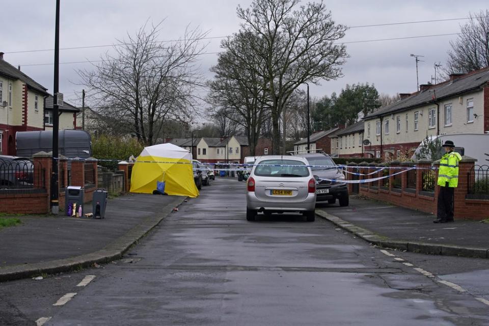 A forensic tent on Thirlmere Avenue in Stretford, Manchester, near to the scene where a 16-year-old boy was fatally stabbed (Peter Byrne/PA) (PA Wire)