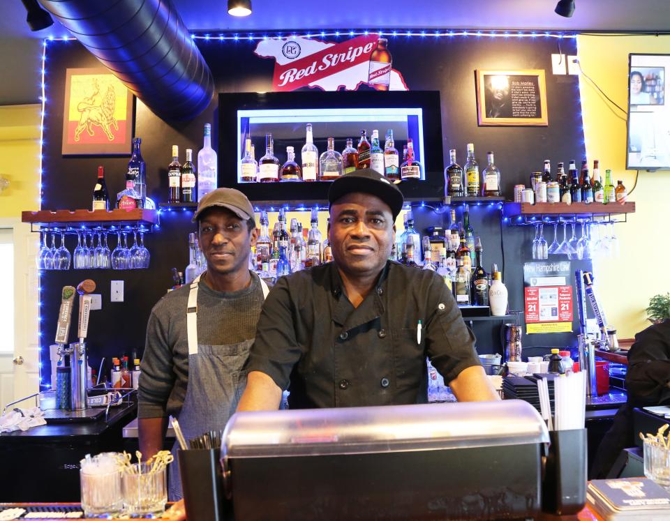 Ramon Hinds, left, and Christopher Nicely are behind the bar at Flame, a new Jamaican restaurant in Somersworth.
