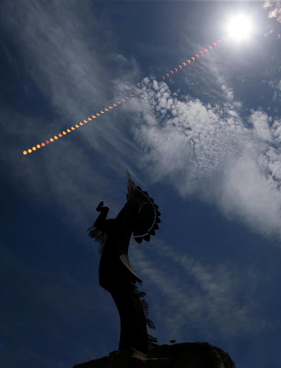 A partial eclipse of the sun fills the sky over The Keeper of the Plains on August 21, 2017. The photo is comprised images taken every three minutes throughout the eclipse.
