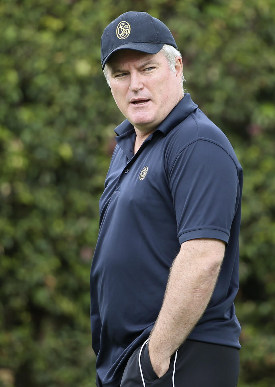 FILE - In this Jan. 3, 2018, file photo, former Australian spin bowler Stuart MacGill helps England's team while training for their cricket test match against Australia in Sydney. MacGill was allegedly kidnapped from his home in Sydney in April 2021, before being released an hour later, Australian media reported Wednesday, May 5, 2021. (AP Photo/Rick Rycroft, File)