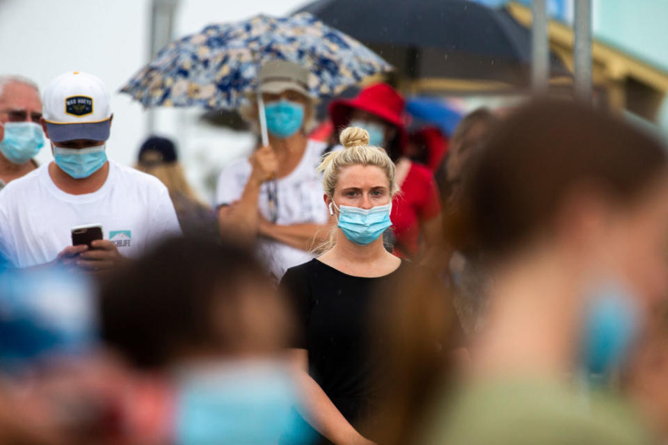 People are seen lining up at a Covid-19 testing site at Mona Vale Hospital.