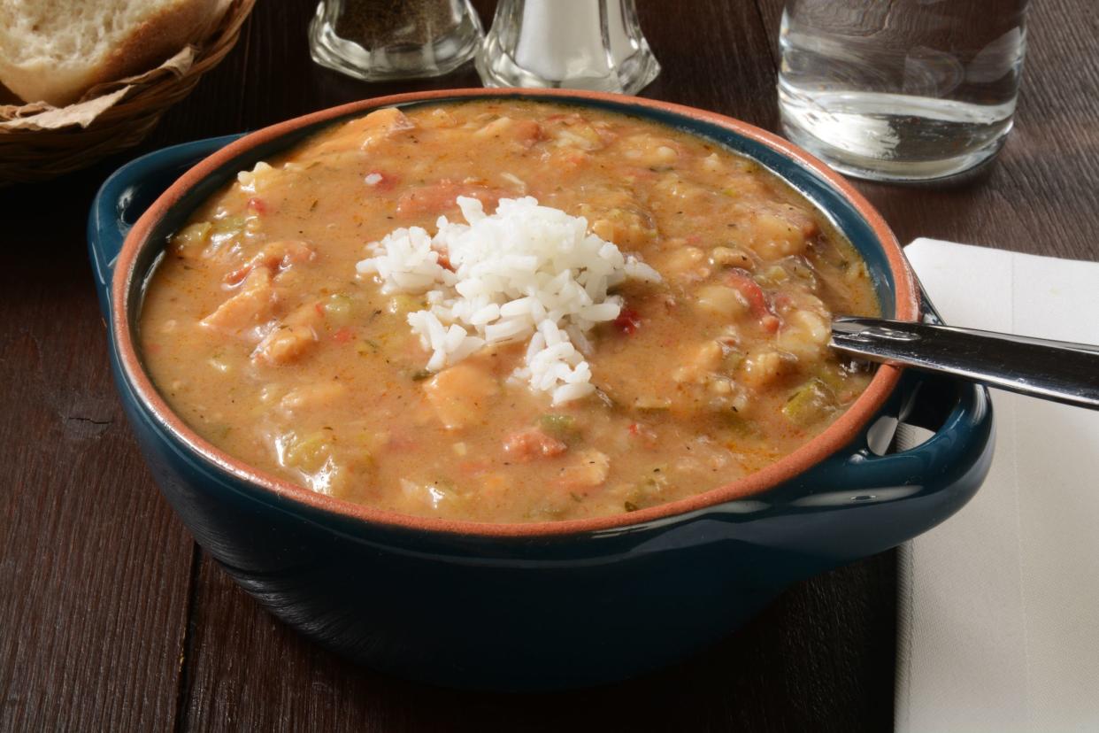 A bowl of smoked sausage and chicken gumbo with white rice