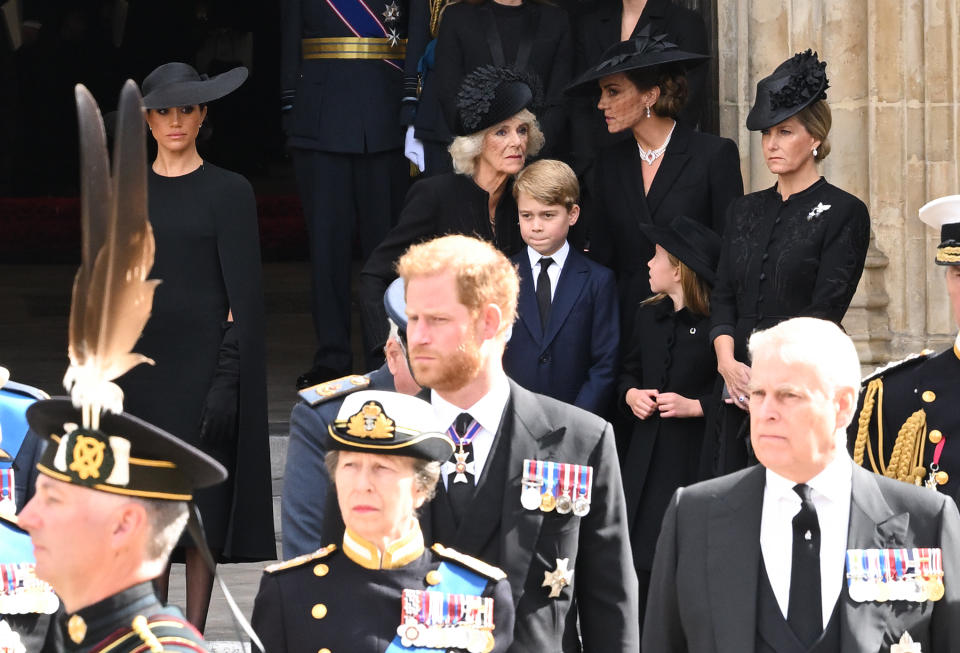 LONDON, ENGLAND - SEPTEMBER 19: Meghan, Duchess of Sussex, Camilla, Queen Consort, Prince George of Wales, Catherine, Princess of Wales, Princess Charlotte of Wales, Sophie, Countess of Wessex, Prince Harry, Duke of Sussex, Anne, Prince Royal and Prince Andrew, Duke of York during the State Funeral of Queen Elizabeth II at Westminster Abbey on September 19, 2022 in London, England. Elizabeth Alexandra Mary Windsor was born in Bruton Street, Mayfair, London on 21 April 1926. She married Prince Philip in 1947 and ascended the throne of the United Kingdom and Commonwealth on 6 February 1952 after the death of her Father, King George VI. Queen Elizabeth II died at Balmoral Castle in Scotland on September 8, 2022, and is succeeded by her eldest son, King Charles III. (Photo by Karwai Tang/WireImage)