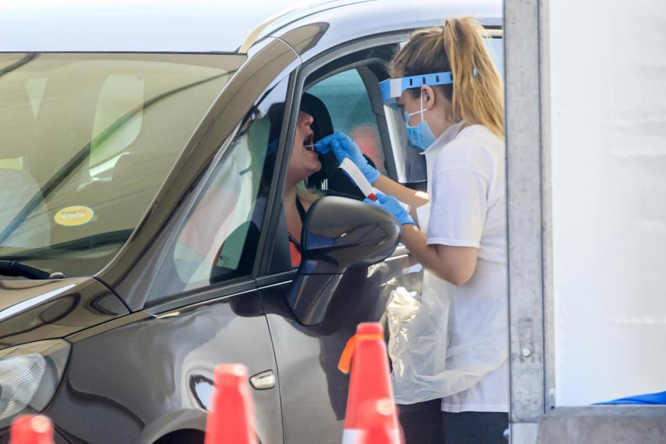 Samples are taken at a coronavirus testing facility in Temple Green Park and Ride, Leeds, as NHS Test and Trace - seen as key to easing the lockdown restrictions - is rolled out across England: Danny Lawson/PA Wire/PA Images