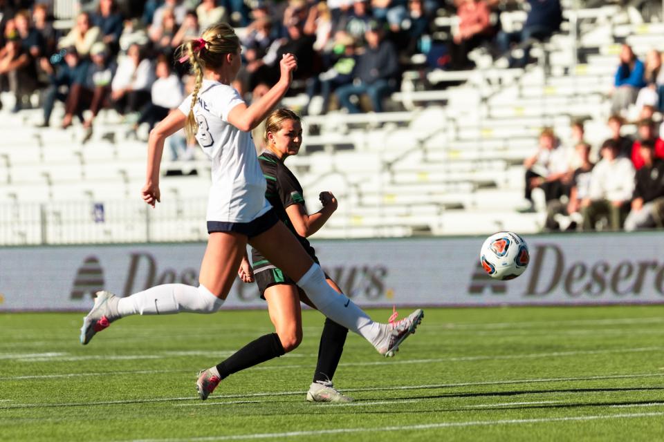 Green Canyon’s Austin Miller, right, and Ridgeline’s Sydnee Zollinger chase after the ball during the girls soccer 4A semifinals at Zions Bank Stadium in Herriman on Monday, Oct. 16, 2023. | Megan Nielsen, Deseret News