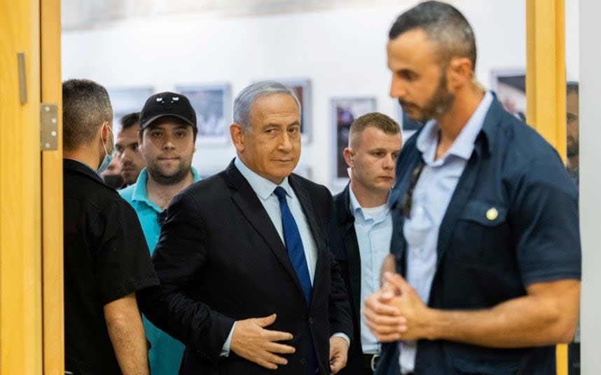 Benjamin Netanyahu, pictured centre in Jerusalem, is Israel's longest-serving prime minister - Yonatan Sindel /AP