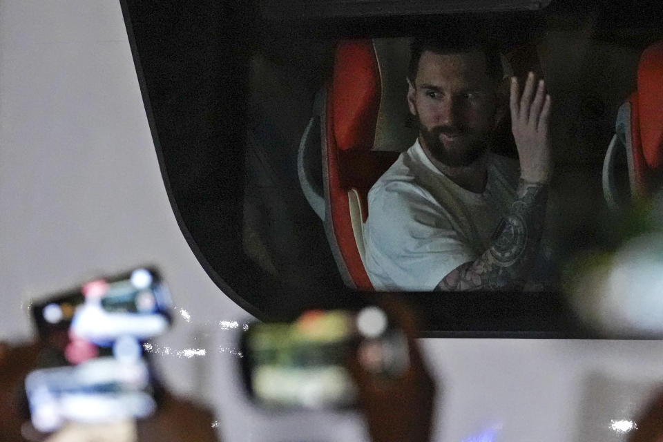 Lionel Messi gestures to Chinese fans on a bus as he and other members of the Argentina national soccer team return to their hotel from practicing in Beijing, Tuesday, June 13, 2023. Argentina is scheduled to play Australia in a friendly match in China's capital on Thursday. (AP Photo/Andy Wong)