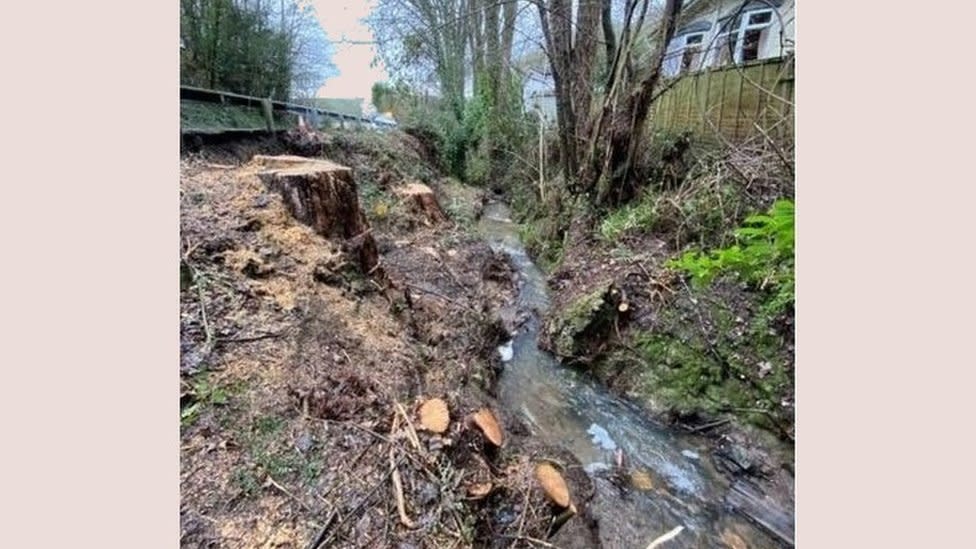 A picture of the A40 landslip site showing rocks and debris in the water