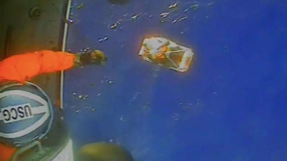 PHOTO: A member of the U.S. Coast Guard works during a rescue of four Canadians about 140 miles off the coast of North Carolina, in a still from a video released by the USCG on Oct. 22, 2023. (U.S. Coast Guard)