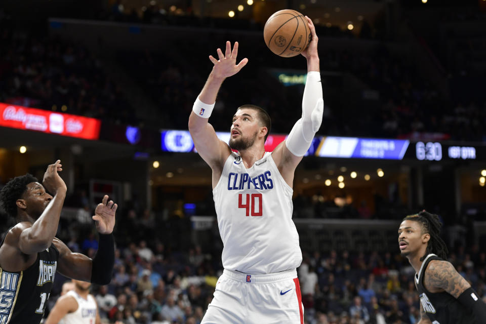 Los Angeles Clippers center Ivica Zubac (40) handles the ball in the first half of an NBA basketball game against the Memphis Grizzlies, Friday, March 31, 2023, in Memphis, Tenn. (AP Photo/Brandon Dill)