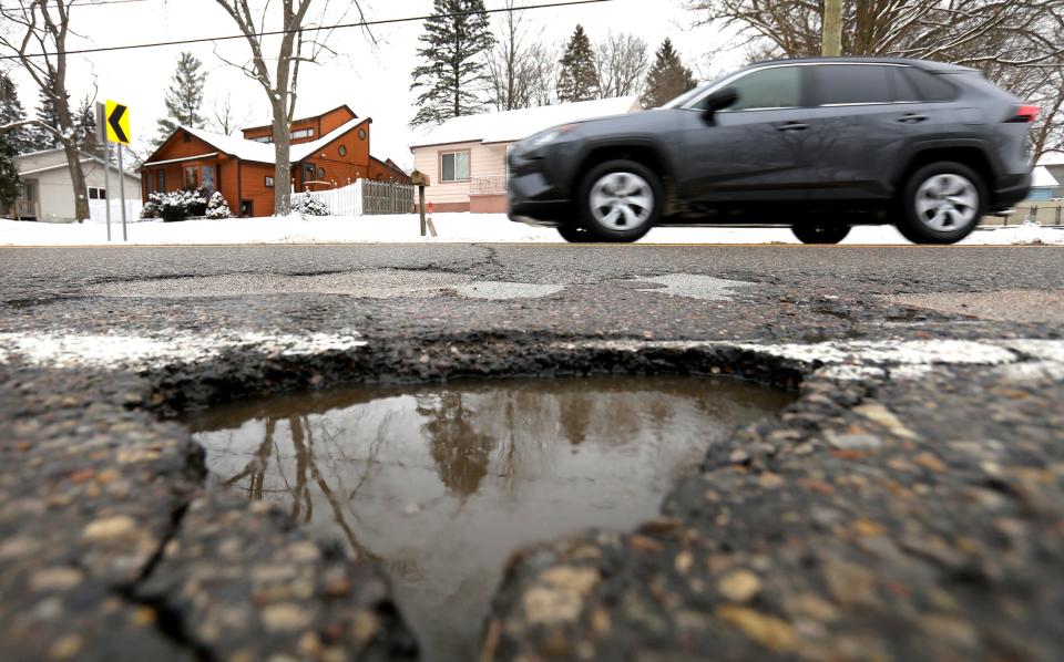 One of several potholes found on Crescent Lake Road in Waterford, Michigan on Wednesday, February 27, 2019.Many people that run over potholes and get damage to their tires or rims have a hard time getting various cities to pay for damages.