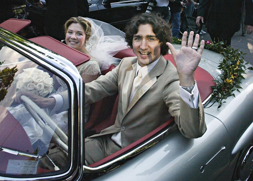 Justin Trudeau, son of the late Prime Minister Pierre Trudeau, leaves with his new bride Sophie Gregoire in his father's 1959 Mercedes 300 SEL after their marriage ceremony in Montreal Saturday, May 28, 2005.(CP PHOTO/Ryan Remiorz)