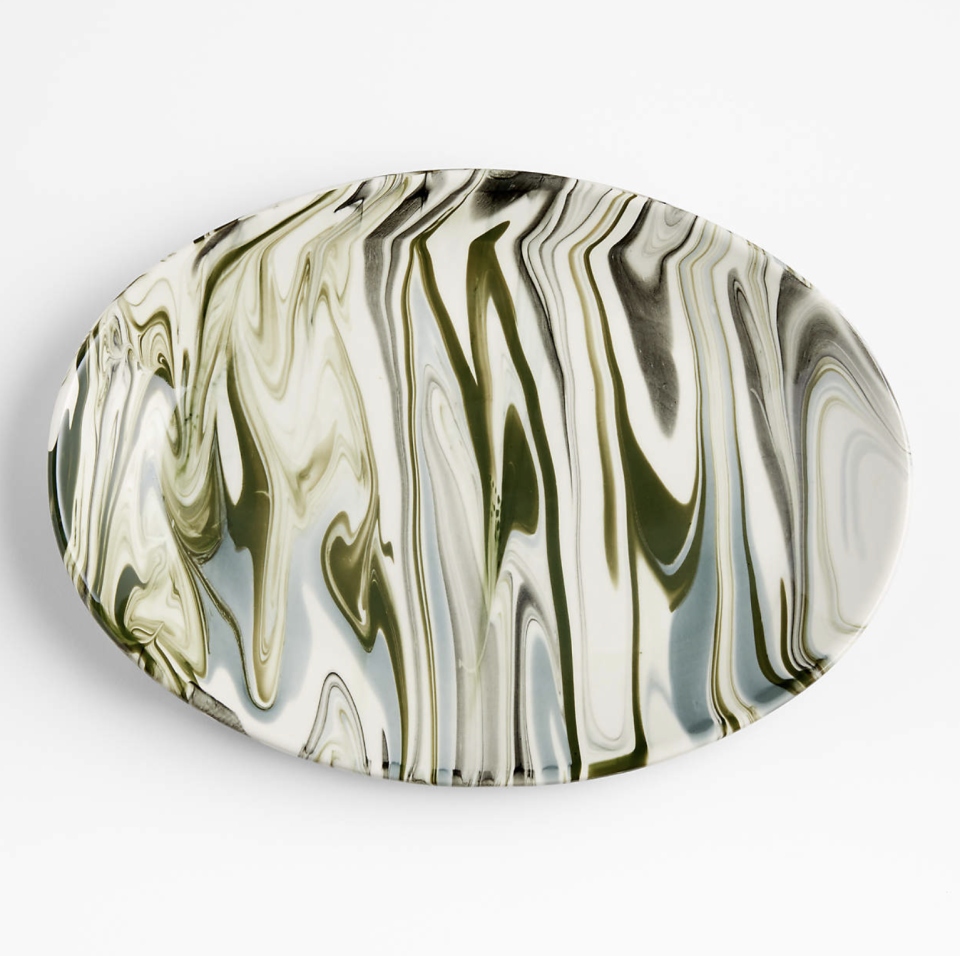 <p><a href="https://go.redirectingat.com?id=74968X1596630&url=https%3A%2F%2Fwww.crateandbarrel.com%2Fsimone-marbleized-stoneware-serving-platter%2Fs446426&sref=https%3A%2F%2Fwww.veranda.com%2Fluxury-lifestyle%2Fentertaining%2Fg37417072%2Fhostess-gifts%2F" rel="nofollow noopener" target="_blank" data-ylk="slk:Shop Now;elm:context_link;itc:0;sec:content-canvas" class="link ">Shop Now</a></p><p>Simone Marbleized Stoneware Serving Platter</p><p>Crate & Barrel</p><p>$39.95</p>