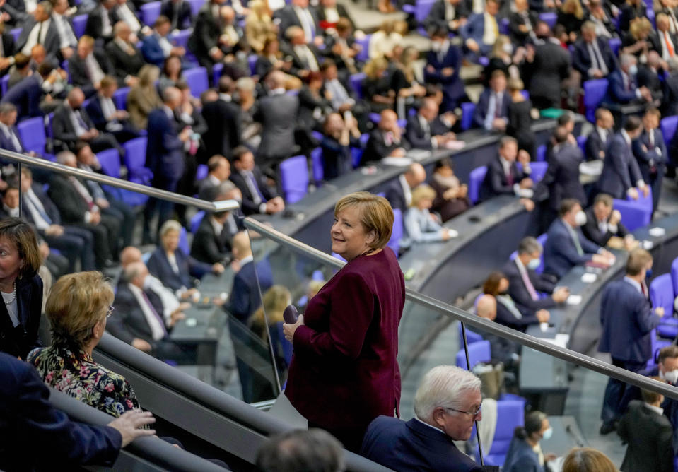 German Chancellor Angela Merkel looks around during the first plenary session of the German parliament Bundestag after the elections, Berlin, Tuesday, Oct. 26, 2021. At right German President Frank-Walter Steinmeier. (Photo/Markus Schreiber)