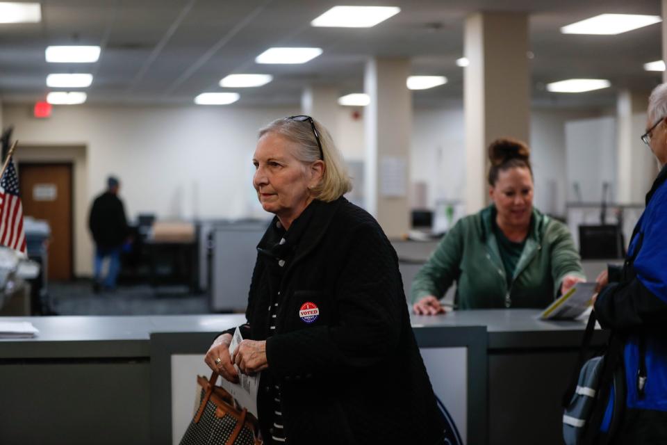 Mary Romanelli of Urbandale gets her ballot for the first day of early voting at the Polk County Auditor’s Office in downtown Des Moines on Wednesday, Oct. 19, 2022. Today was the first day of early voting in the 2022 election for Polk County voters.