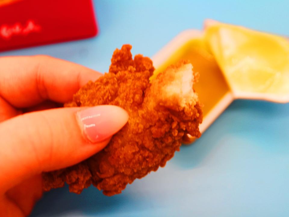 chick fil a chicken tender dipped in honey mustard