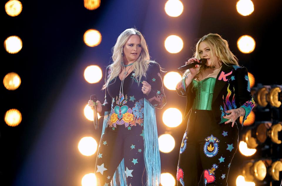 Miranda Lambert (left) and Elle King gave a fiery performance in coordinating starry suits.