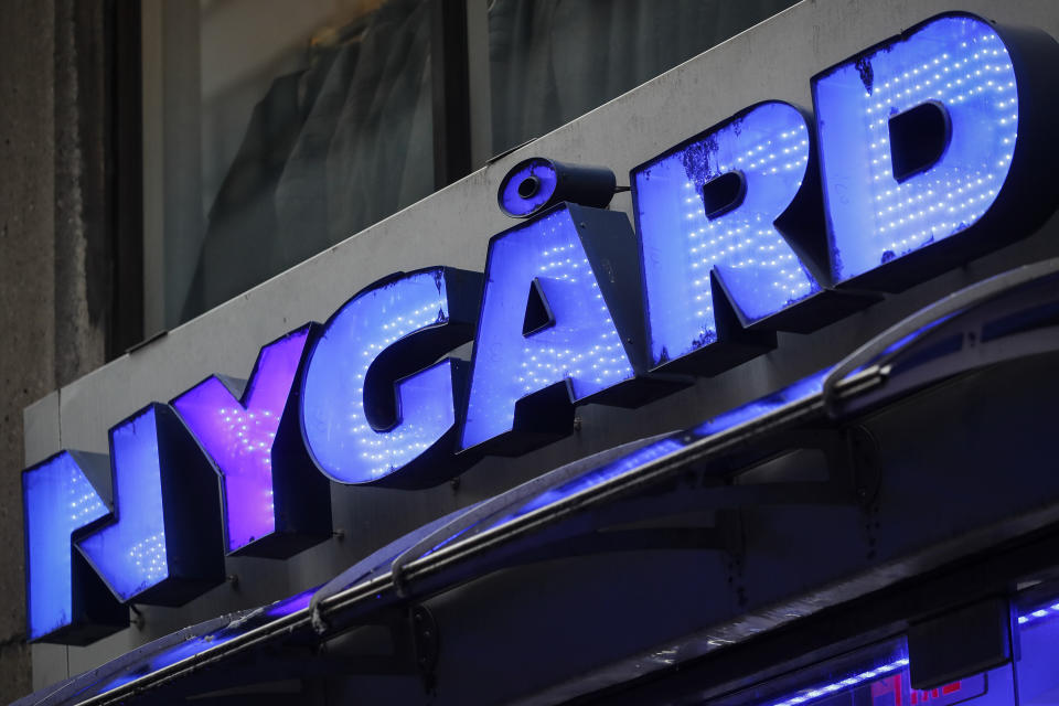 FILE - A sign is displayed above the storefront of Peter Nygard's Times Square headquarters, Tuesday, Feb. 25, 2020, in New York. Former Canadian fashion mogul Nygard pleaded not guilty Thursday, Sept. 21, 2023, to all charges against him in his Toronto sexual assault case, as jury selection for his trial got underway. (AP Photo/John Minchillo, File)