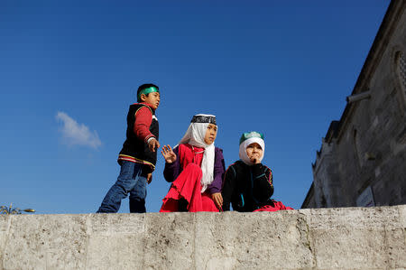 Uighur children play in the courtyard of Fatih Mosque, a common meeting place for pro-Islamist demonstrators in the city, before a protest against China, in Istanbul, Turkey, December 28, 2018. REUTERS/Murad Sezer