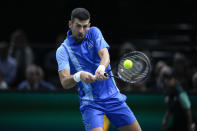 Serbia's Novak Djokovic returns the ball to Bulgaria's Grigor Dimitrov during the final match of the Paris Masters tennis tournament at the Accor Arena, in Paris, Sunday, Nov. 5, 2023. (AP Photo/Michel Euler)