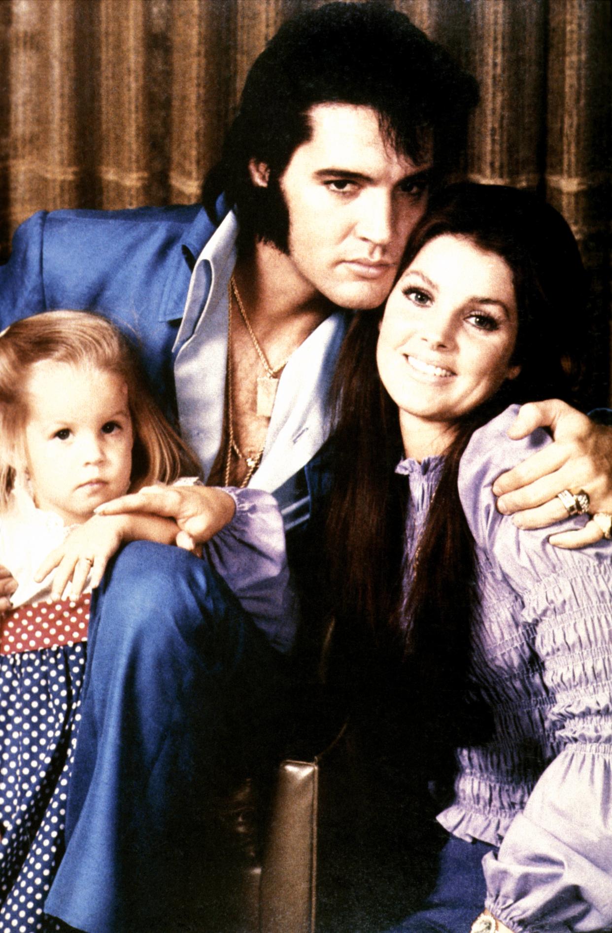 Lisa-Marie Presley with her parents, Elvis and  Priscilla Preslet, in 1970. (Photo: GAB Archive/Redferns)