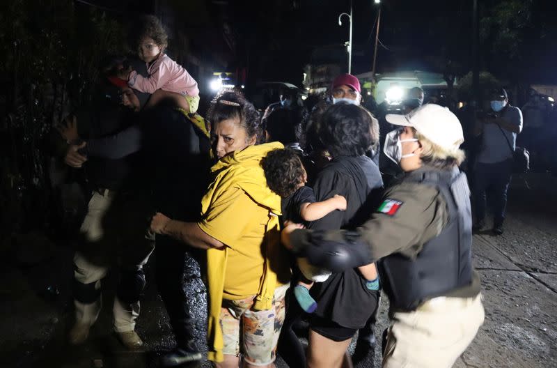 Agents of the National Migration Institute and National Guard detain migrants from Central America and the Caribbean, in Huixtla