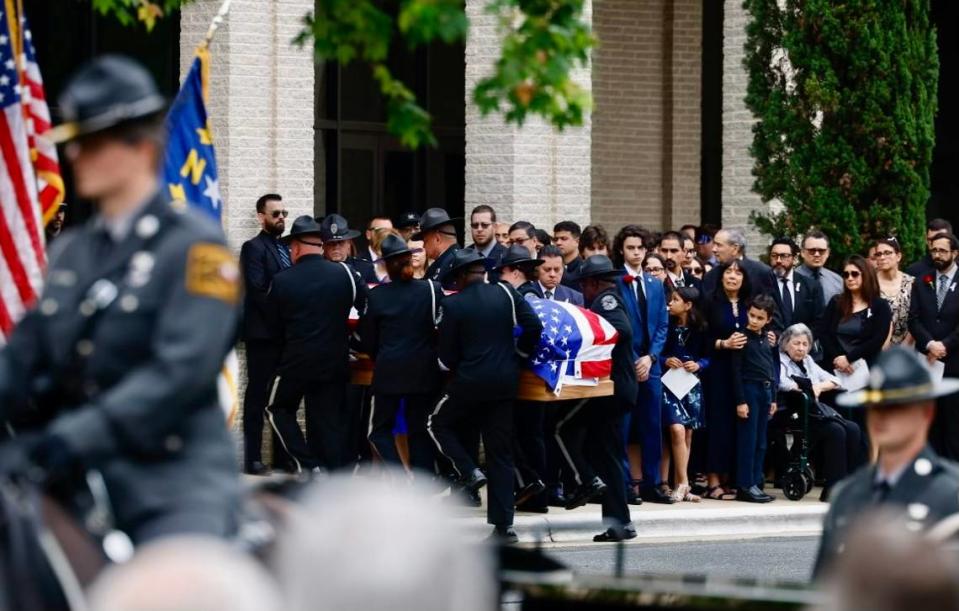 A caisson procession for Investigator Sam Poloche of the N.C. Department of Adult Correction makes its way to First Baptist Church in Charlotte for the memorial service on Monday, May 13, 2024. Poloche killed in the line of duty while serving a warrant in east Charlotte on Monday April 29, 2024.
