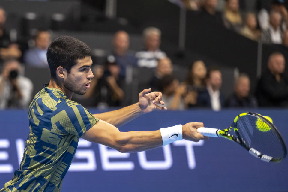 Spain's Carlos Alcaraz returns the ball to Britain's Jack Draper during their first round match at the Swiss Indoors tennis tournament at the St. Jakobshalle in Basel, Switzerland, Monday Oct. 24, 2022. (Georgios Kefalas/Keystone via AP)