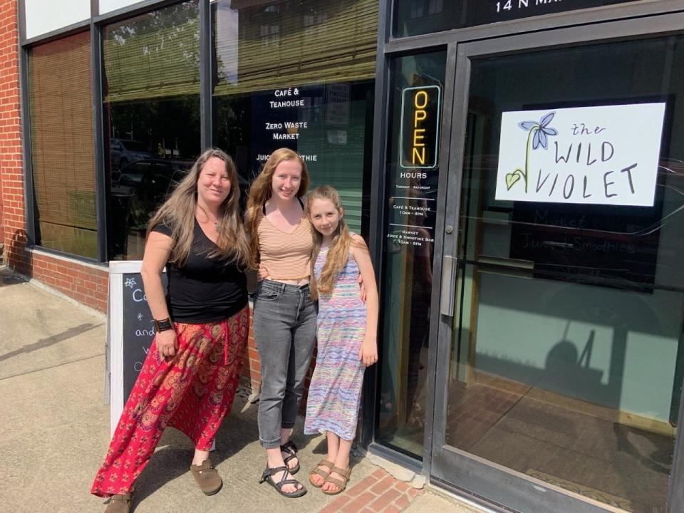 "There are many aspects of it that are really amazing about (working with my daughters)," said Wild Violet owner Michele Clark, pictured at left with her daughters Sydney, center, and Sadie. "I support them, and they support me."