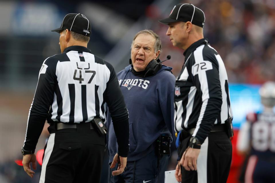 New England Patriots Bill Belichick, center, speaks with officials during the first half of an NFL football game against the Kansas City Chiefs, Sunday, Dec. 17, 2023, in Foxborough, Mass. (AP Photo/Michael Dwyer)