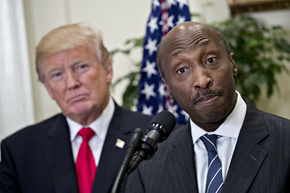 Ken Frazier, chairman and CEO&nbsp;of Merck, speaks while U.S. President Donald Trump, left, listens during an announcement on a new pharmaceutical glass packaging initiative in the Roosevelt Room of the White House in July. (Photo: Bloomberg via Getty Images)