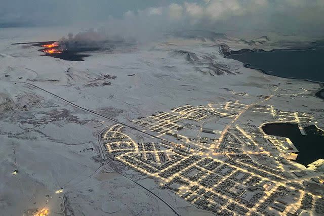 <p>VIKEN KANTARCI/AFP via Getty </p> Aerial view of the volcanic eruption near Grindavik, Iceland