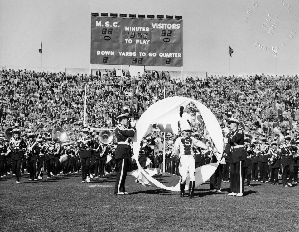 The Michigan State College Marching Band at The University of Michigan vs. MSC game at Macklin Field on Nov. 14, 1953 during the pregame show.