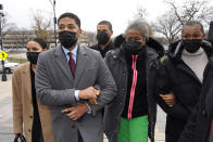 Actor Jussie Smollett, left, arrives with his mother Janet, center, and other family members at the Leighton Criminal Courthouse for day three of his trial in Chicago on Wednesday, Dec. 1, 2021. Smollett is accused of lying to police when he reported he was the victim of a racist, anti-gay attack in downtown Chicago nearly three years ago. (AP Photo/Charles Rex Arbogast)