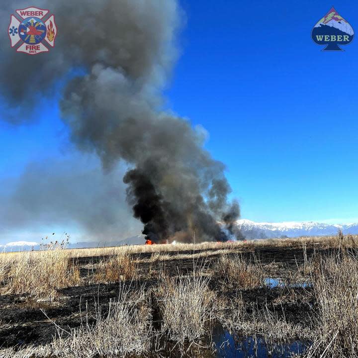 Smoke billows above Ogden Bay Friday, April 12, as fire authorities instigated a 2,000-acre controlled burn. (Credit: Weber Fire District)