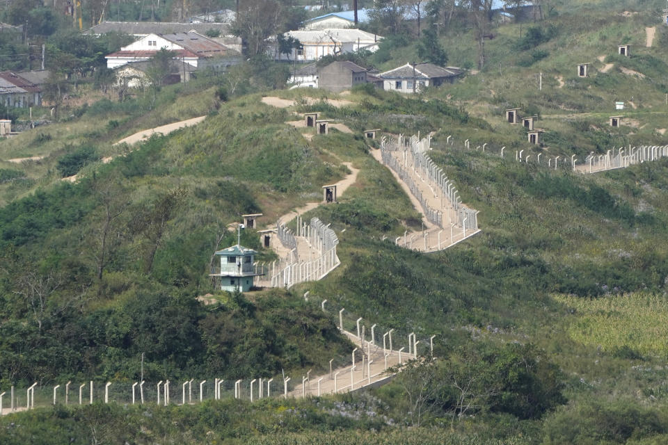 Guard posts and fences ring a hill side on the North Korea border with Russia and China seen from China's Yiyanwang Three Kingdoms viewing platform in Fangchuan in northeastern China's Jilin province Tuesday, Sept. 12, 2023. After decades of complicated, hot-and-cold relations, Russia and North Korea have drawn closer since Moscow's invasion of Ukraine in 2022. The bond has been driven by Russian President Vladimir Putin's need for war supplies and North Korean leader Kim Jong Un's efforts to boost his partnerships with traditional allies Moscow and Beijing as he tries to break out of diplomatic isolation. (AP Photo/Ng Han Guan)