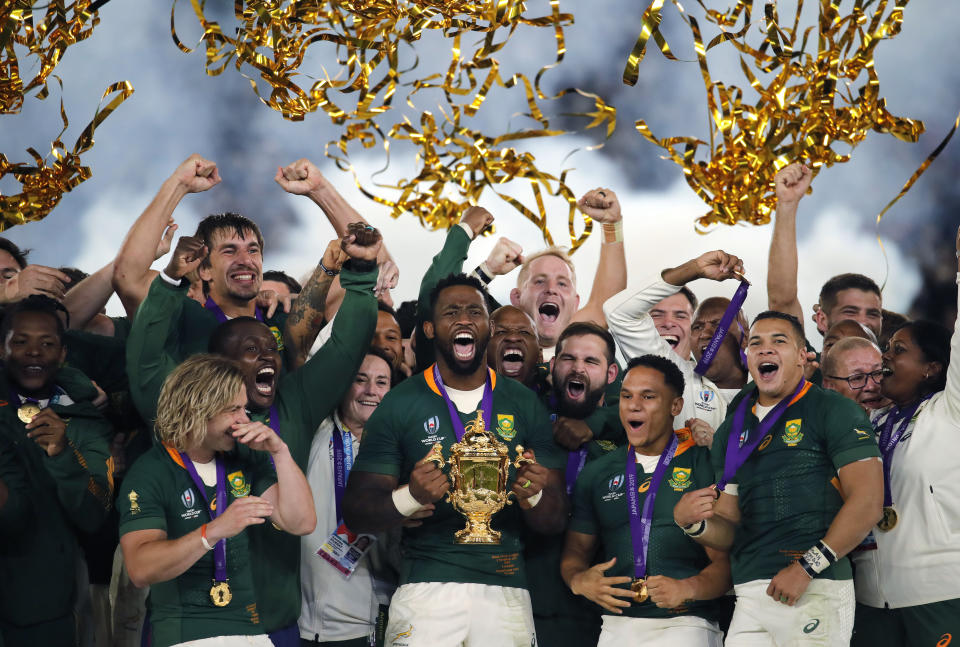 FILE - South African captain Siya Kolisi holds the Webb Ellis Cup aloft after South Africa defeated England to win the Rugby World Cup final at International Yokohama Stadium in Yokohama, Japan, on Nov. 2, 2019. This Rugby World Cup was always the ultimate goal for the Springboks coaching combination of Rassie Erasmus and Jacques Nienaber, who sat down soon after taking over a struggling team in early 2018 and began plotting a five-year plan to build a squad for France 2023. (AP Photo/Christophe Ena, File)