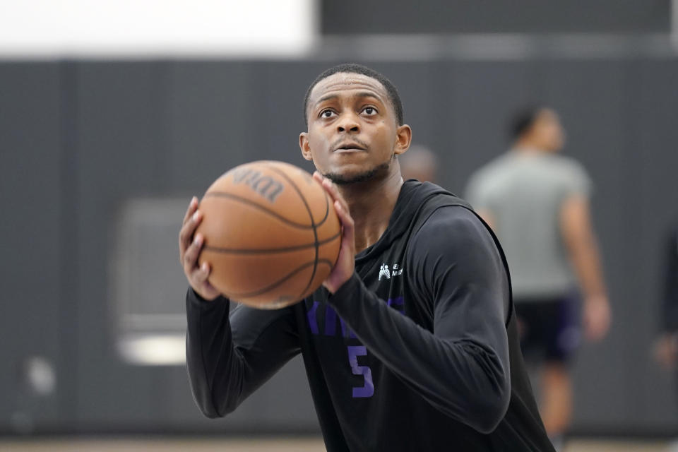 Sacramento Kings guard De'Aaron Fox shoots a free throw at the NBA basketball team's training camp in Sacramento, Calif., Thursday, Oct. 6, 2022. (AP Photo/Rich Pedroncelli)