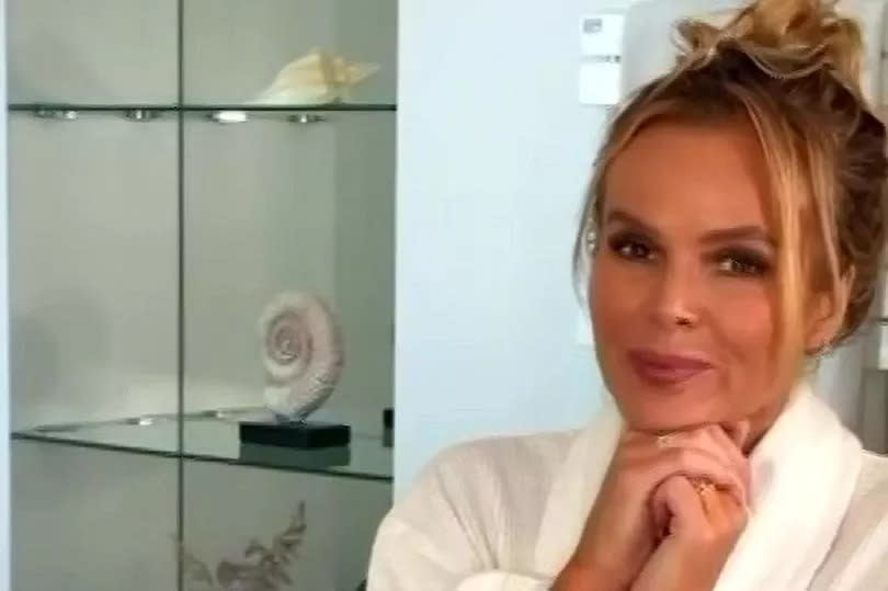 Amanda Holden in a bathroom as part of a promotional video for a brand.