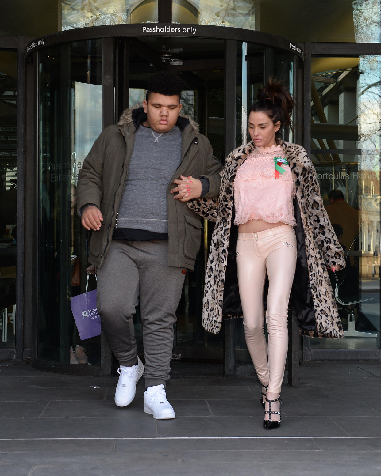 Katie Price with her son Harvey leaves Portcullis House in London after giving evidence to the Commons Petitions Committee where she called for online abuse to be made a specific offence. (Photo by Nick Ansell/PA Images via Getty Images)