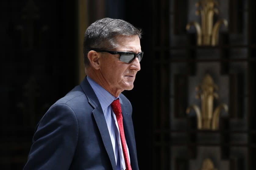 FILE - In this Monday, June 24, 2019, file photo, Michael Flynn, President Donald Trump's former national security adviser, departs a federal courthouse after a hearing, in Washington. Trump said Sunday, March 15, 2020, that he is considering a full pardon for Flynn, who had pleaded guilty to lying to the FBI about dealings with Russia's ambassador before Trump took office. (AP Photo/Patrick Semansky, File)