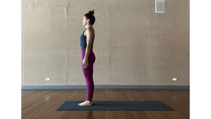 Woman learning how to do Crow Pose