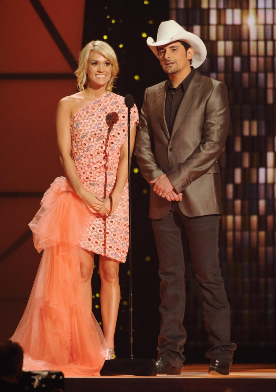 Carrie Underwood and Brad Paisley speak at the 45th annual CMA Awards