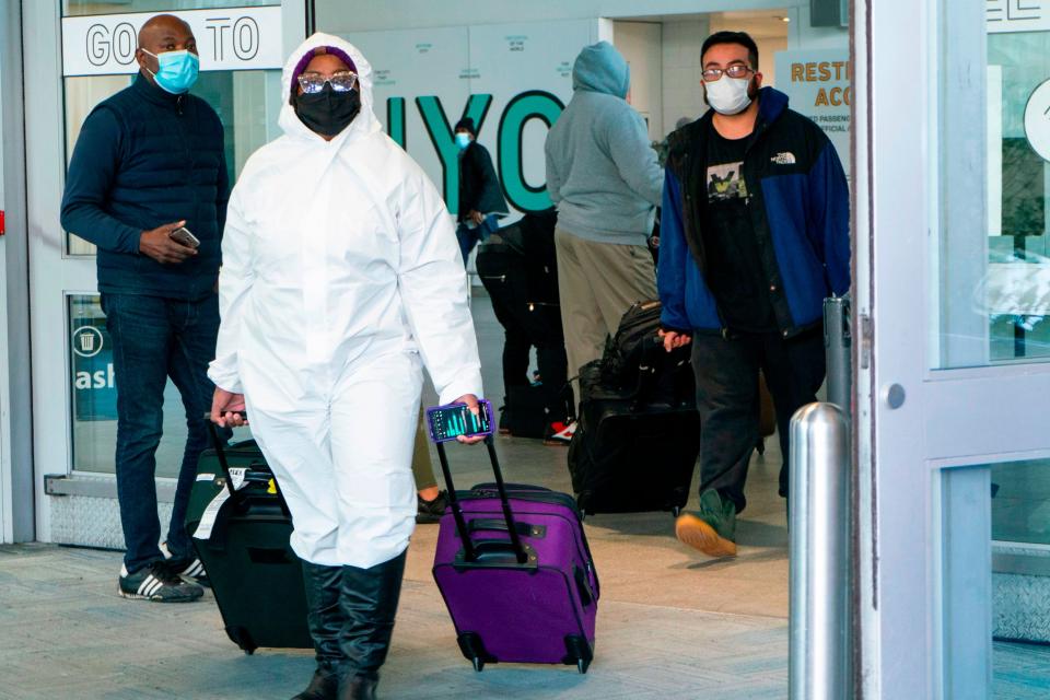 Passengers arrive at JFK International airport in New York (AFP via Getty Images)