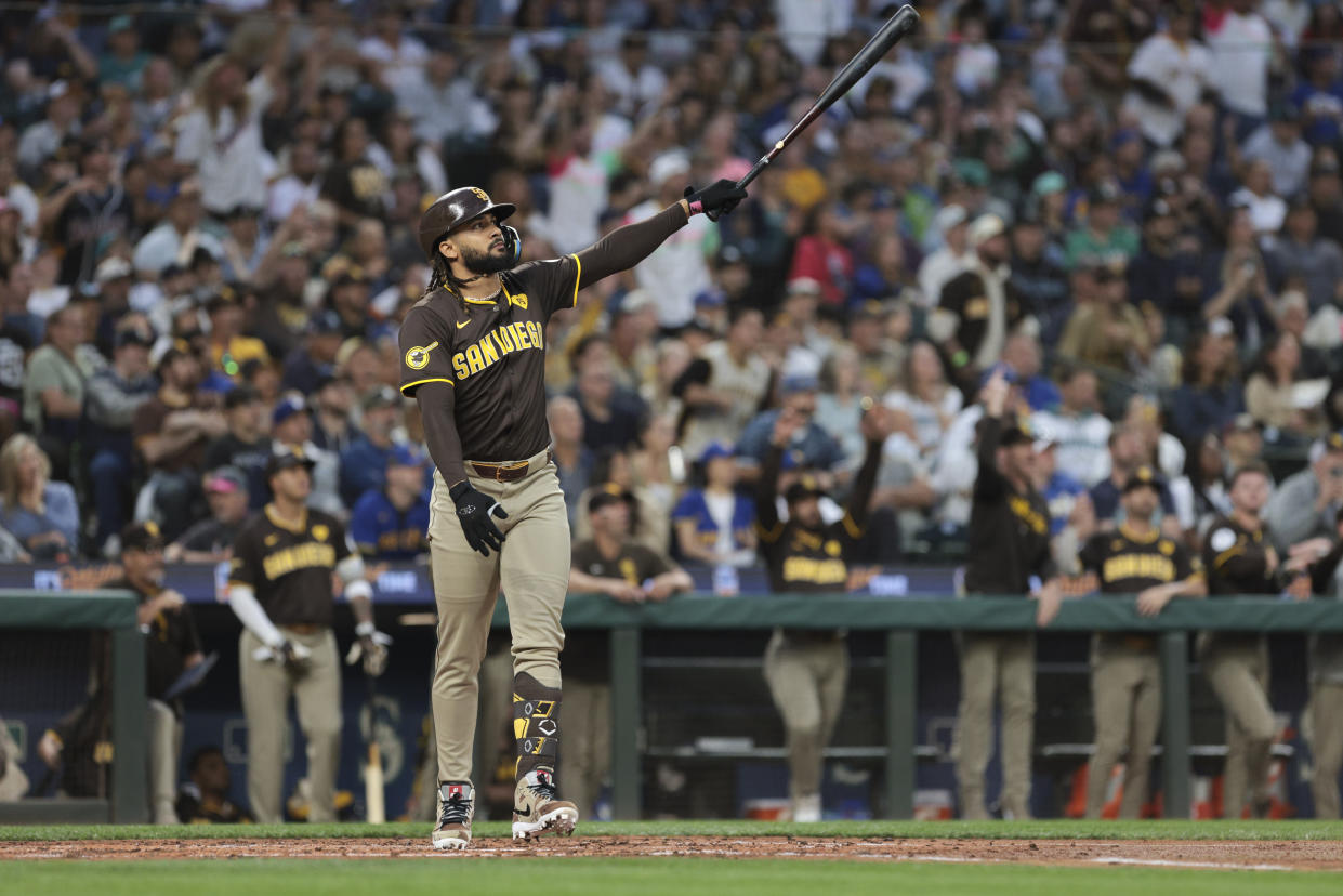 San Diego Padres' Fernando Tatis Jr. follows through after hitting a three-run home run off Seattle Mariners starting pitcher George Kirby to score Donovan Solano and Luis Arraez during the third inning of a baseball game, Tuesday, Sept. 10, 2024, in Seattle. (AP Photo/Jason Redmond)